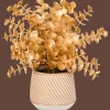 Gouden kunstplant in pot